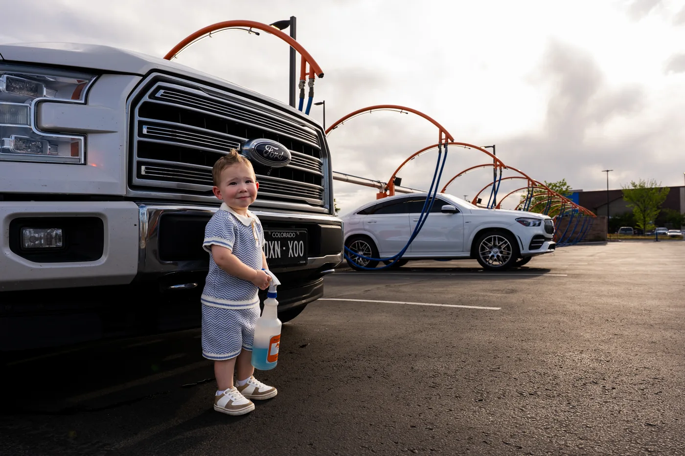 Happy woman with clean car